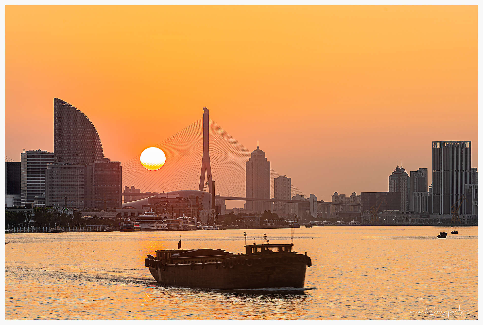 Sun rising over Huangpu bridge